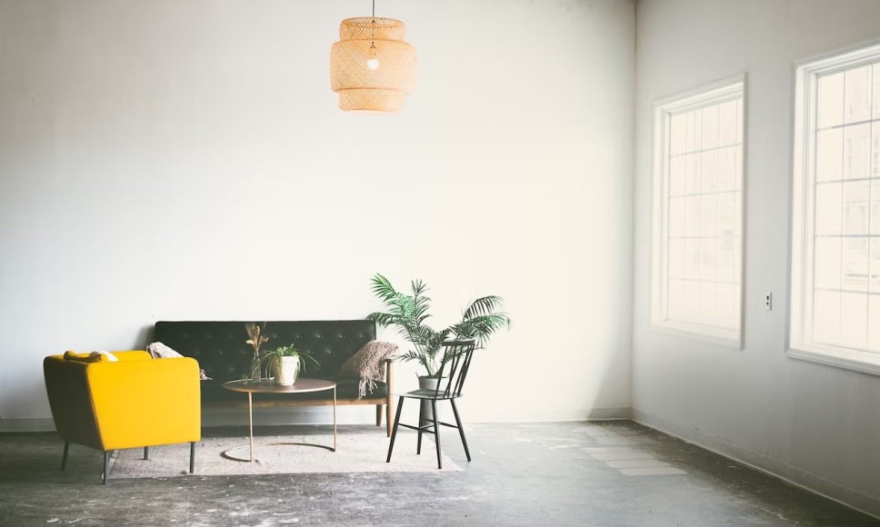 Stone floor and wall section with outdoor lighting entering the space