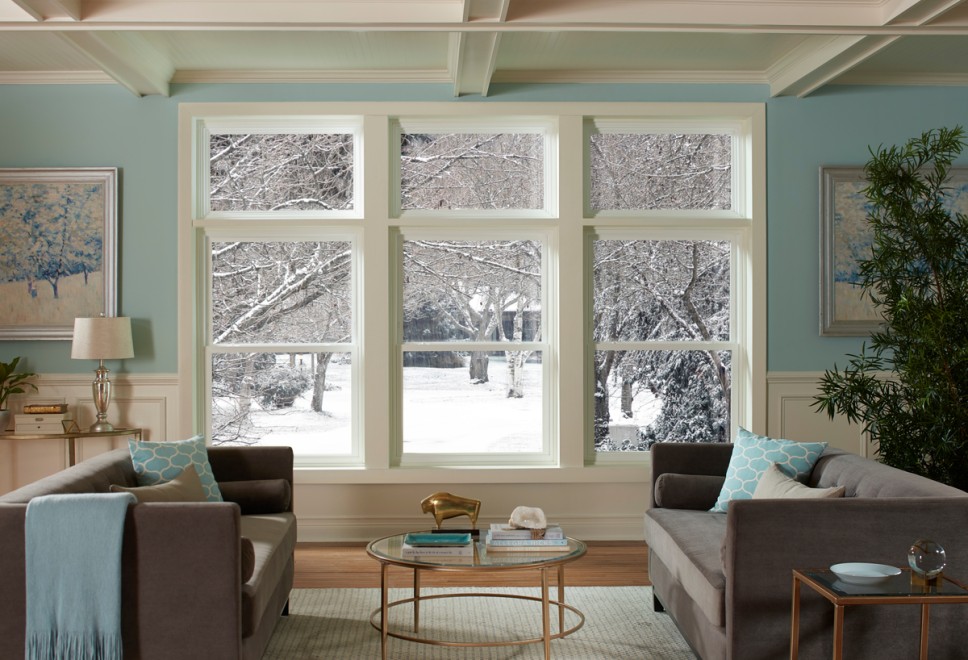 Image of a room with white windows overlooking a snowy yard