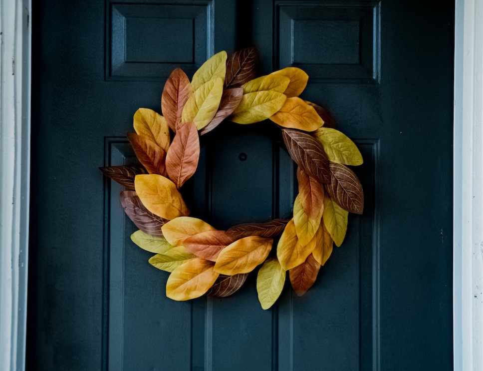 Front door with a holiday wreath