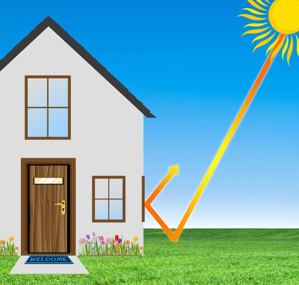 Image of sun reflecting against window tint on a house